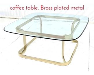 Lot 468 Contemporary Glass top coffee table. Brass plated metal