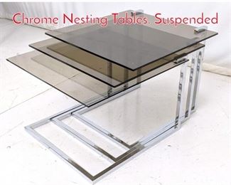 Lot 484 Set of 3 Smoked Glass Chrome Nesting Tables. Suspended 