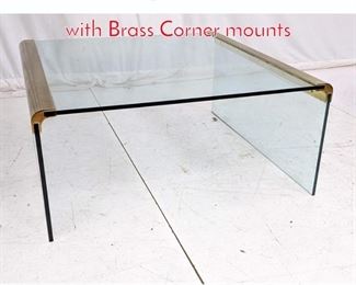 Lot 490 Pace style Coffee Table. Glass with Brass Corner mounts