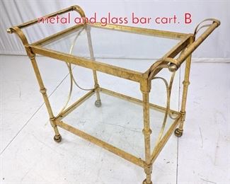 Lot 572 Decorator gold gilt painted metal and glass bar cart. B
