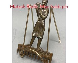 Lot 633 Hebrew Bronze Metal Figural Matzoh Radle. Man holds pla
