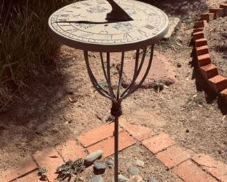 Sun dial on garden stake stand