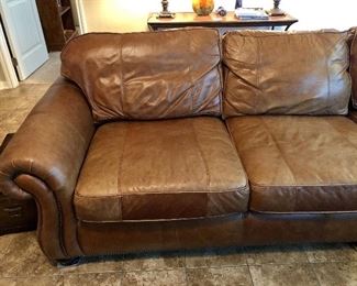 Bernhardt leather sectional sofa. Three pieces. 
Dimensions:
Width 112"
Depth 112"
Height 37 1/2"
Arm Height 27 1/2"
Seat Depth 20"