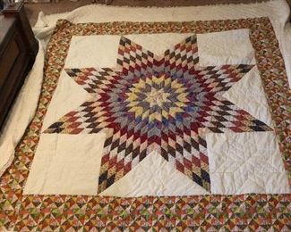Lone Star/Star of Bethlehem quilt. Handpiece and quilted, machine border. 8“ star pattern border with Ila trim. 105” x 90”.