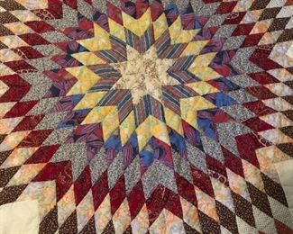 Lone Star/Star of Bethlehem quilt. Handpiece and quilted, machine border. 8“ star pattern border with Ila trim. 105” x 90”.