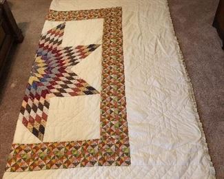 Lone Star/Star of Bethlehem quilt. Handpiece and quilted, machine border. 8“ star pattern border with Ila trim. 105” x 90”.