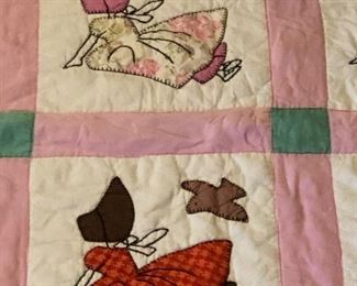 Sunbonnet Sue/Birdie quilt. All hand quilted. Light age spots. Stain on one corner. Solid pink backing. 75” x 64”