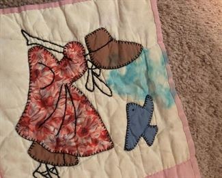 Sunbonnet Sue/Birdie quilt. All hand quilted. Light age spots. Stain on one corner. Solid pink backing. 75” x 64”