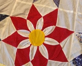 Amazing three-dimensional sunflower topper. 4 inch yellow border with Ila trim. Hand quilted with machine stitch hand appliquéd, three dimensional work. 117” x 96”