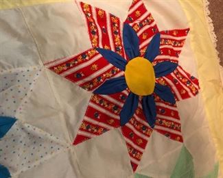 Amazing three-dimensional sunflower topper. 4 inch yellow border with Ila trim. Hand quilted with machine stitch hand appliquéd, three dimensional work. 117” x 96”