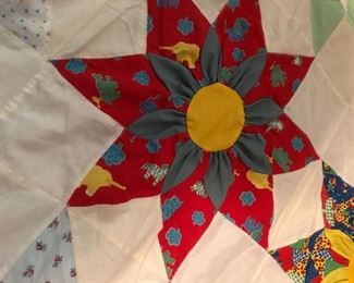 Amazing three-dimensional sunflower topper. 4 inch yellow border with Ila trim. Hand quilted with machine stitch hand appliquéd, three dimensional work. 117” x 96”