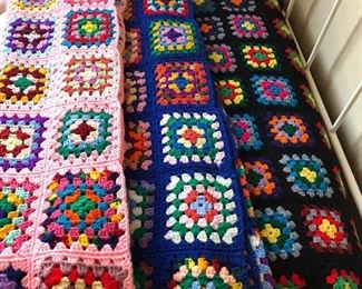 Pretty vintage crocheted granny square afghan blankets.