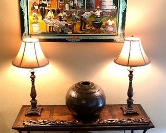 Wrought iron table, set of matching lamps, woven basket, drip glazed pot.