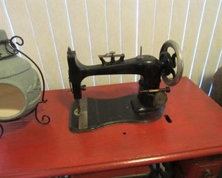 sewing machine in cabinet