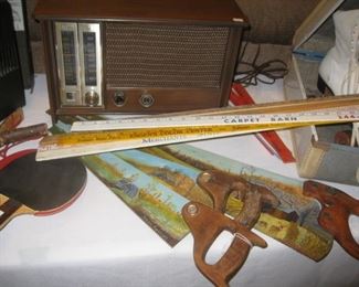 Vintage radio, painted saws, yard sticks