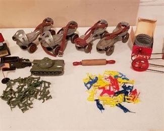 Lot of Vintage Toys - 2 pair of Steel Wheel Skates, 2 Metal Slinkys w/boxes, Whee-Lo, Plastic Cowboys/Indians and Army Men
