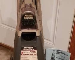 Hoover Steam Vac Ultra with Bottle of Cleaning Solution - powers on