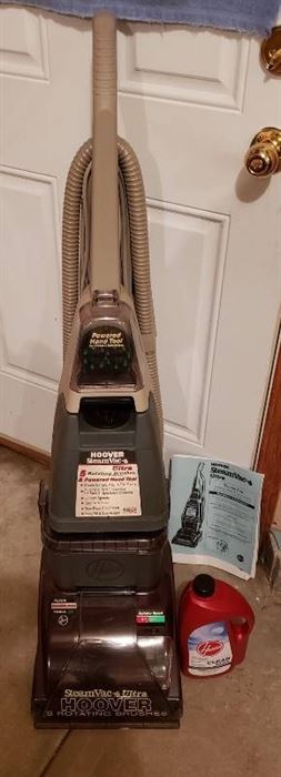 Hoover Steam Vac Ultra with Bottle of Cleaning Solution - powers on