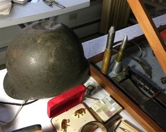 WWII era helmet and trench art ammunition shells