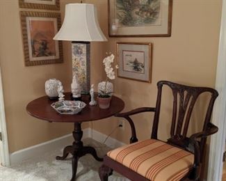 Beautifully carved mahogany armchair, with eagle head arms, vintage mahogany tilt-top table, vintage Asian porcelain table lamp, blanc de chien Asian porcelain collection, nicely framed/matted Asian themed art.