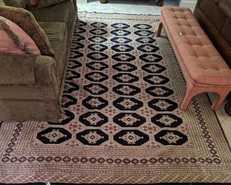 Hand woven Bokhara wool rug, measures 8' x 10'.