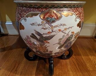 Nice Asian porcelain fishbowl on wooden stand.