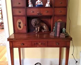 LOVE this vintage mahogany desk, with collection of vintage Staffordshire porcelain dogs and cats, resting lion, vintage Spaniel bookends and vintage cast iron miniature cannon. 