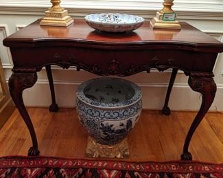 Nicely carved 1940's mahogany game table, with detailed claw feet, large blue/white Asian porcelain fishbowl on solid gold (;-)) carved wood capital base.