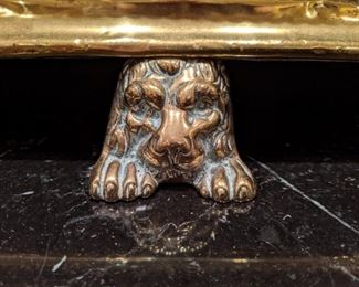 Picture of the lion head feet on the vintage English fire bumper. 