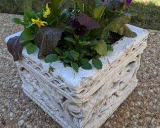 Another very nice square concrete planter, with oh so appropriate Atlanta annuals.