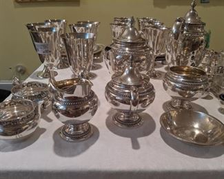 Nice selection of sterling silver. 12 sterling goblets, Gorham tea set, nut dishes, creams and sugars, etc.; some Tiffany items.