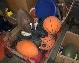 Antique wagon filled with various sport balls