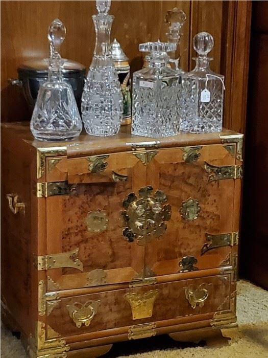 Smaller Korean chest. Inside consists of many small drawers.  Crystal Decanters (these and more).  Beer steins - tall and short