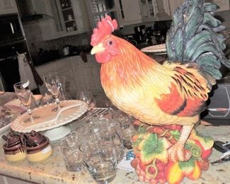 Ceramic Rooster, bar glasses, wine stems and stemless crystal. Cake platters and condiment servers