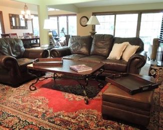 Extra-large rug - Leather oversize ottoman, club chair and sofa. Large wood and iron coffee table