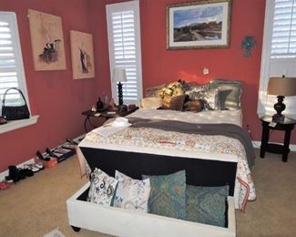 Queen size bed. Feminine art, side tables. Storage Bench, selection of lamps. Museum Prints. Woman's shoes, decorator throw pillows