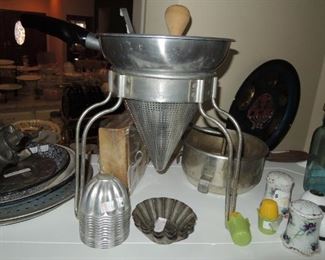 Vintage kitchen: ricer, molds, salt and peppers, mason jars, tin plates and pie plates, sifters, cookie press