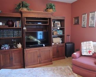 Media cabinet and shelves. Luggage. Floral. Leather bound books