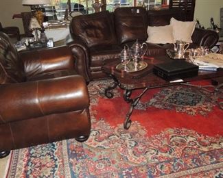 Leather sofa, large chair, Turkish rug, wood and iron coffee table