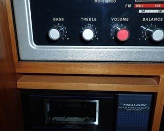 KORONETTE STEREO / PS - STEREO PHONO - SONIC  - BAR - RADIO - RECORD PLAYER - AM / FM  AND FIREPLACE WITH BUILT IN SPEAKERS . TOP PANELS DROP DOWN.