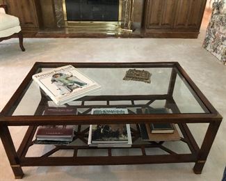 Glass top coffee table, brass accents.