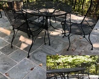 Round wrought iron table with four chairs