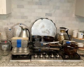 Assortment: Aluminum, baking pans, cookware, pots, vases, mugs, carafe's, knives...