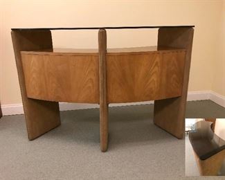 Mid century bar made of wood with suede accents and glass top