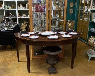 DEMI-LUNE TABLE AND VICTORIAN CAST IRON URN