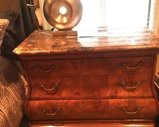 One of two three-drawer chests