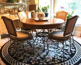 Round Kitchen table with 4 chairs. Plants and Wicker stand not for sale.