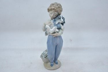 0060 Lladro Figure of a Young Boy Holding a Dog