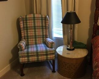 upholstered arm chair and side table