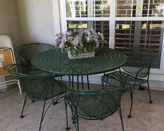 green iron patio table with 4 chairs